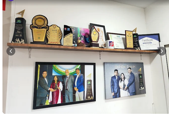 Griva Insurance Solution awards, trophies, and certificates display